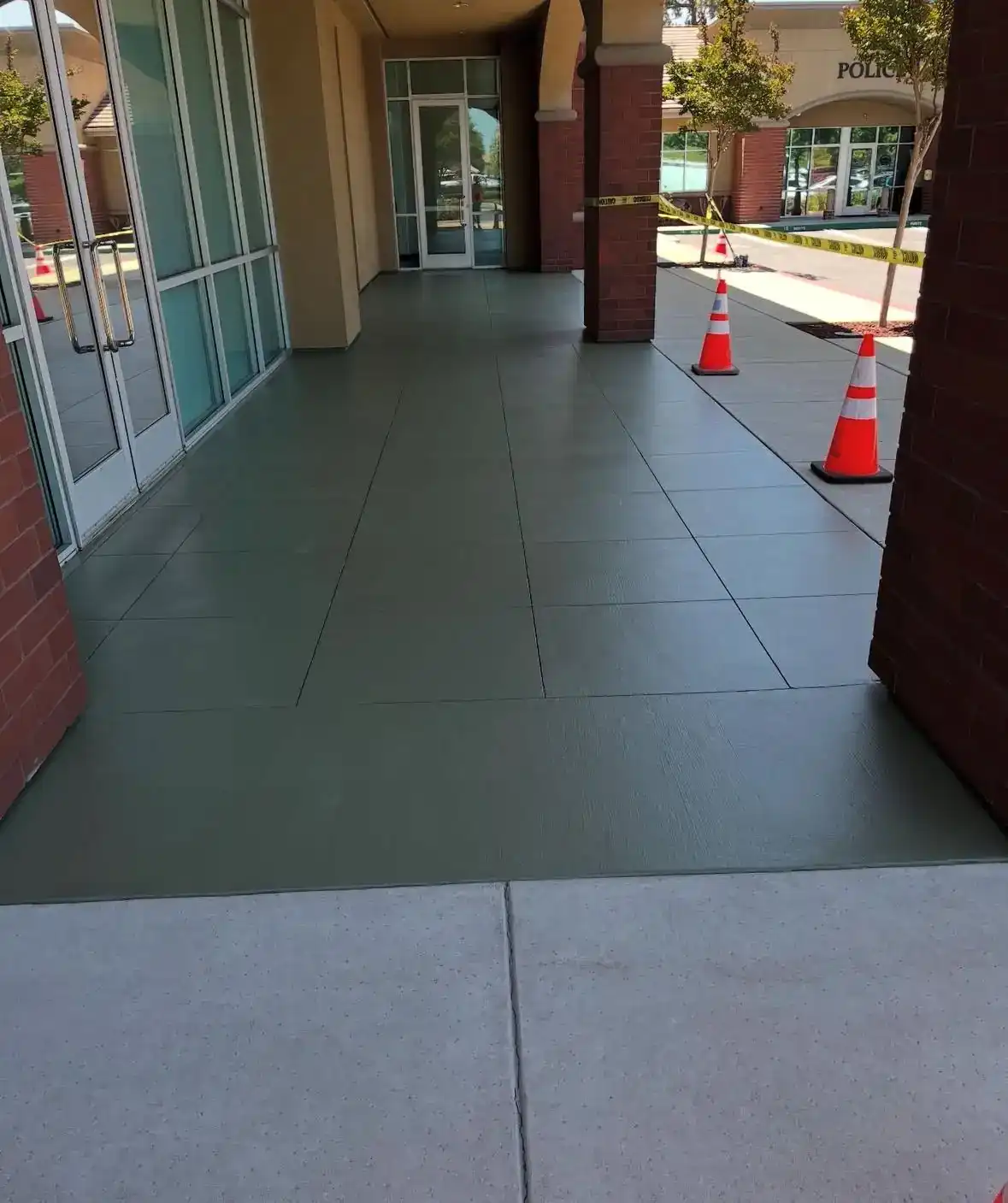 Freshly installed tile walkway along a commercial storefront